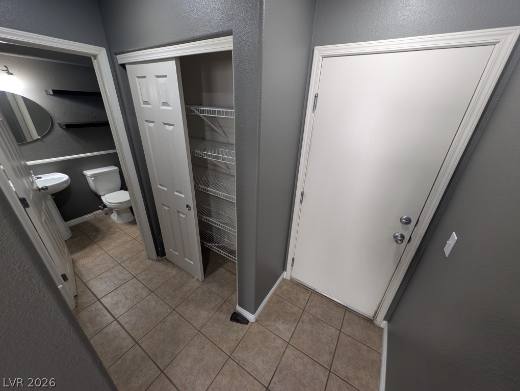 9121 Spoonbill Ridge Place Las Vegas, NV 89143 - Photo 26 of 26 Functional floorplan offering convenient storage, a utility closet, and easy-care tile flooring.