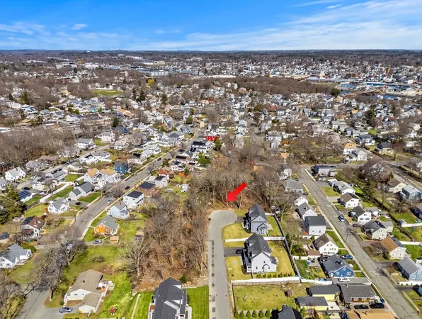an aerial view of residential building and trees