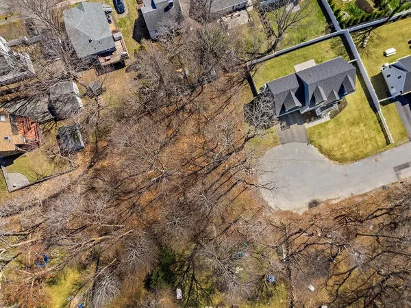 a aerial view of a house with swimming pool
