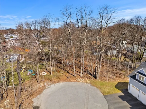 a view of a backyard of the house