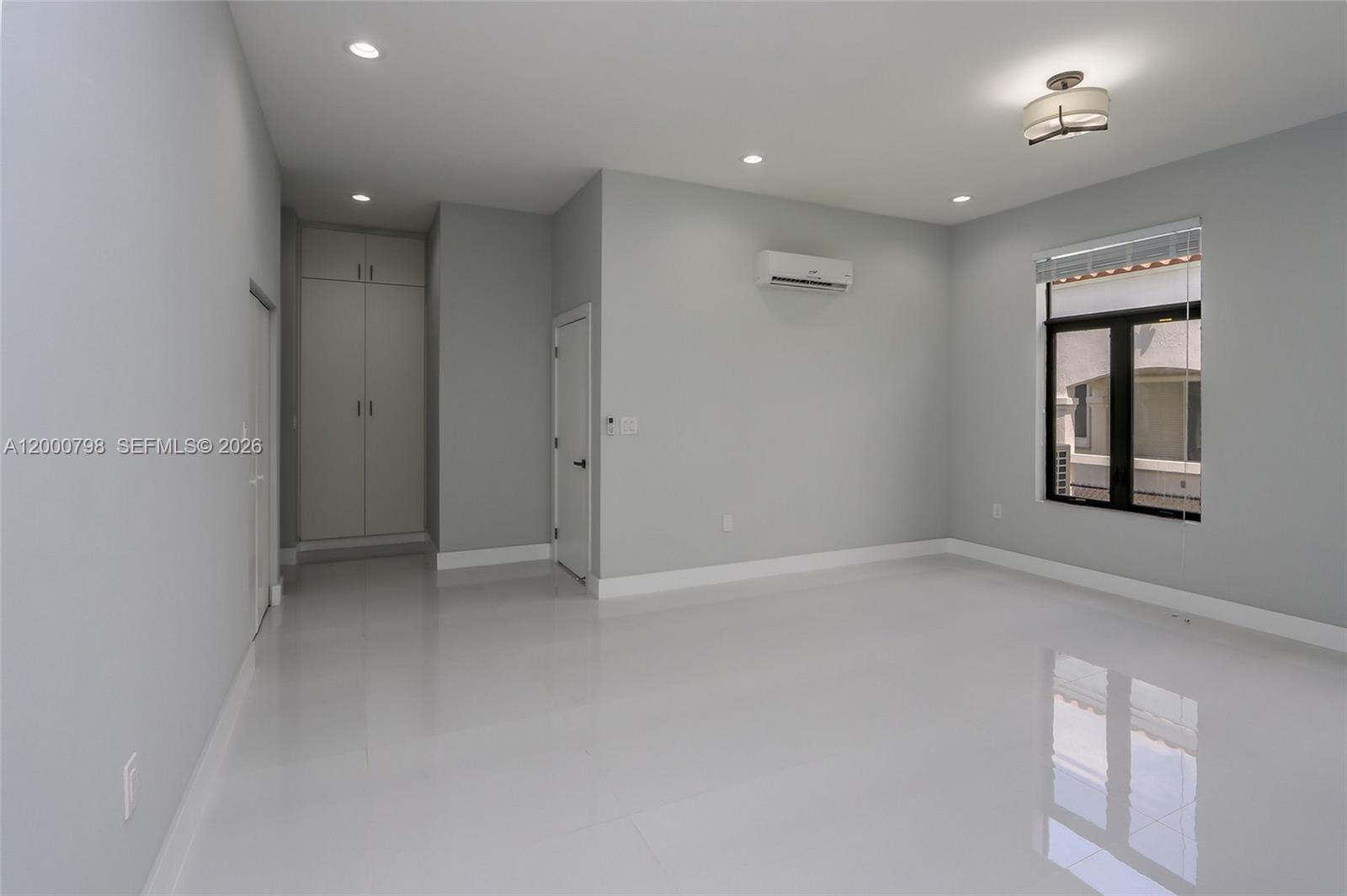 5126 Southwest 57th Avenue Miami, FL 33155 - Photo 13 of 32 an empty room with windows and closet