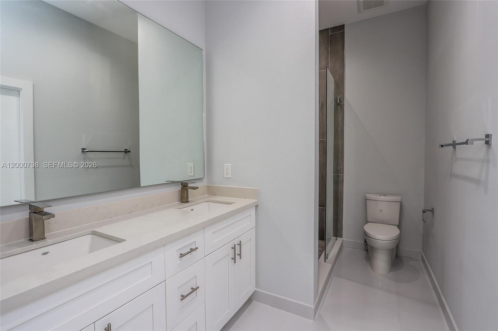 5126 Southwest 57th Avenue Miami, FL 33155 - Photo 15 of 32 a bathroom with a sink and a toilet