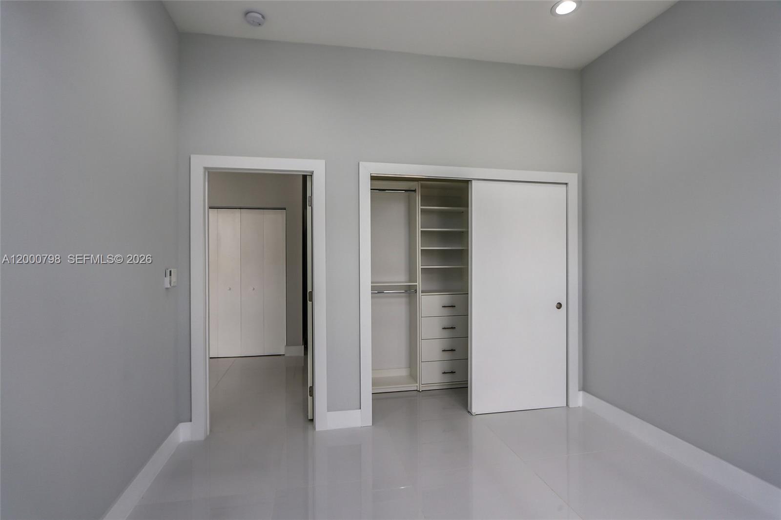 5126 Southwest 57th Avenue Miami, FL 33155 - Photo 20 of 32 an empty room with closet and a window