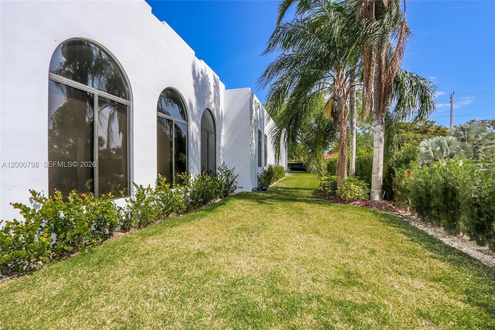 5126 Southwest 57th Avenue Miami, FL 33155 - Photo 28 of 32 a front view of a house with a yard