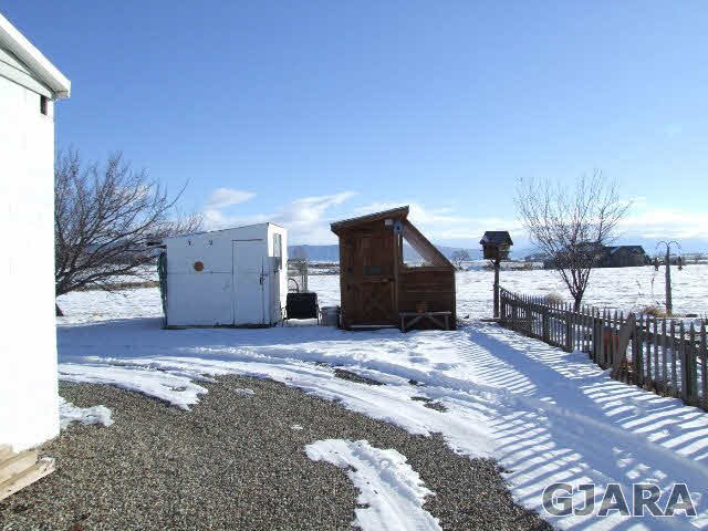 1074 24 Road Grand Junction, CO 81505 - Photo 26 of 37 a view of a house with backyard and trees