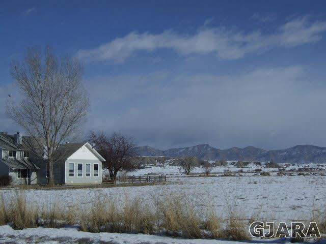 1074 24 Road Grand Junction, CO 81505 - Photo 28 of 37 a front view of a house with a yard