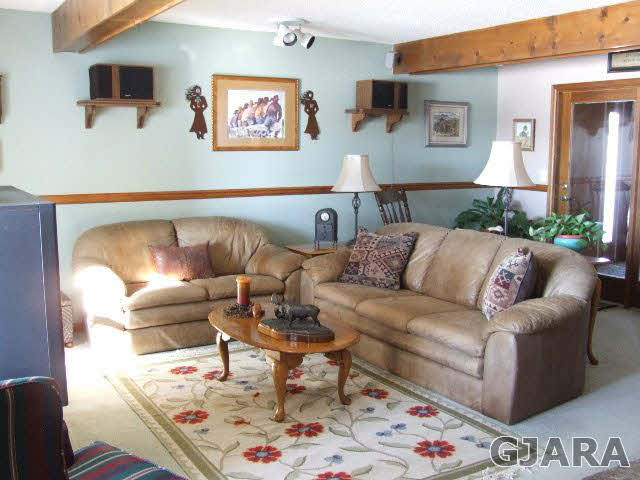 1074 24 Road Grand Junction, CO 81505 - Photo 7 of 37 a living room with furniture and a table
