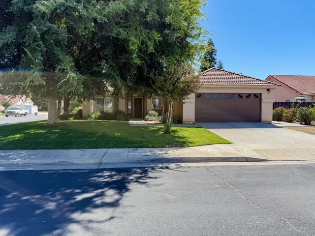 a view of a house with a small yard