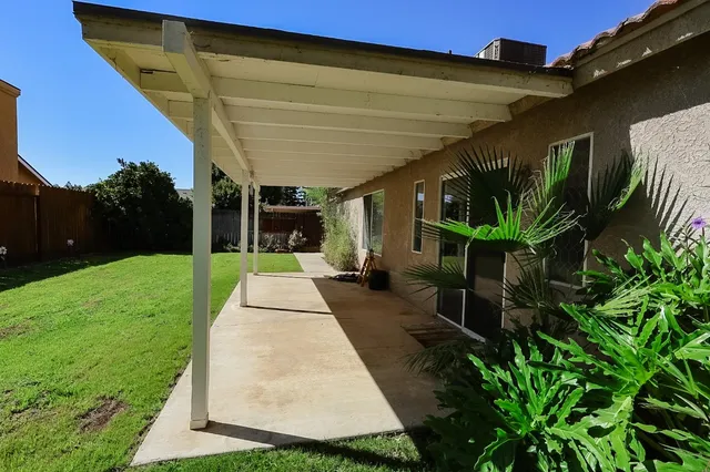 a view of yard with patio