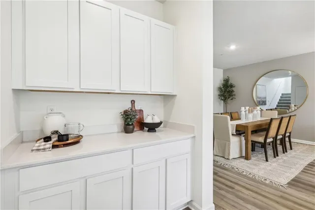 a view of a kitchen counter space and cabinets
