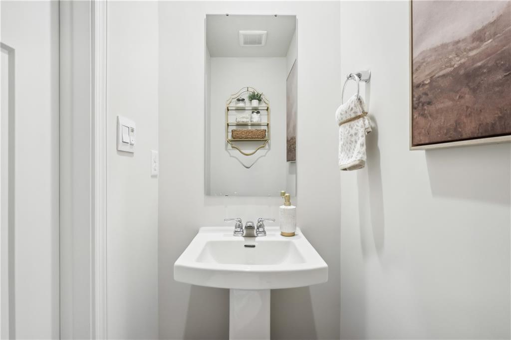 3403 Maple Crest Court Butler, PA 16001 - Photo 12 of 48 a bathroom with a sink and a mirror