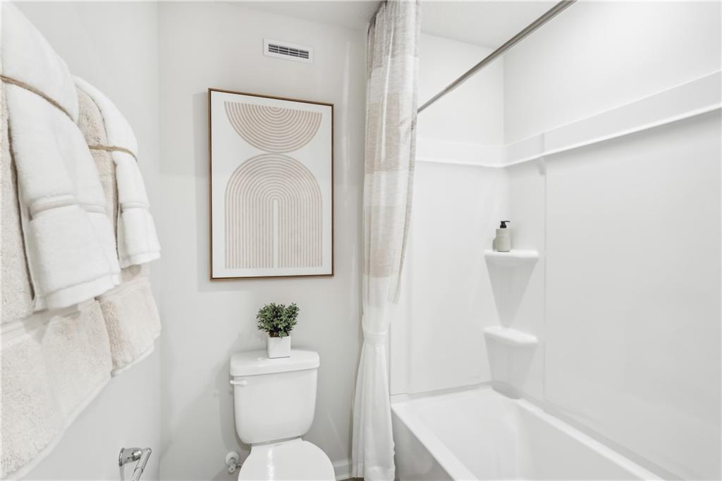 3403 Maple Crest Court Butler, PA 16001 - Photo 16 of 48 a bathroom with a toilet sink and mirror