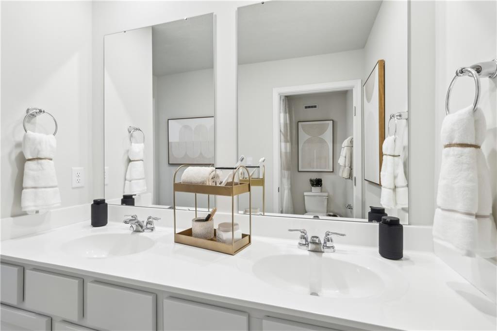 3403 Maple Crest Court Butler, PA 16001 - Photo 18 of 48 a bathroom with double vanity sinks and a mirror