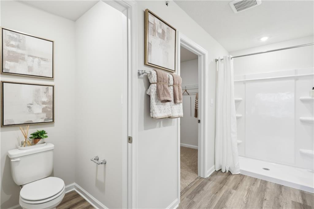 3403 Maple Crest Court Butler, PA 16001 - Photo 30 of 48 a white toilet sitting next to a bathroom sink