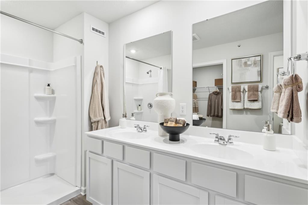 3403 Maple Crest Court Butler, PA 16001 - Photo 31 of 48 a bathroom with a sink and a mirror