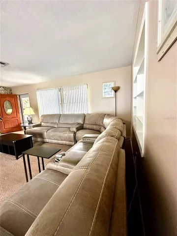 a living room with a couch and a large window