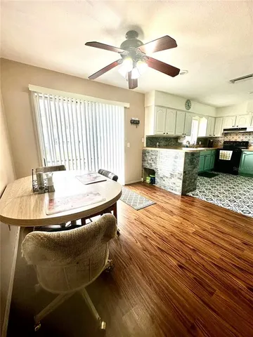 a kitchen with a sink appliances and cabinets