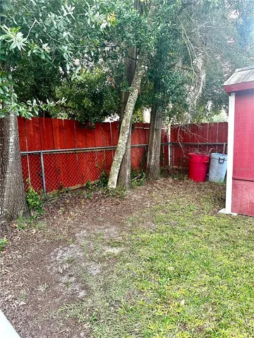 a backyard of a house with lots of green space