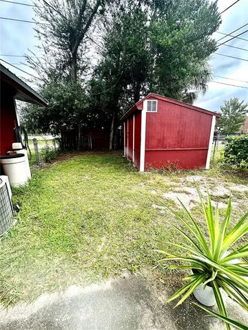 a view of backyard with green space