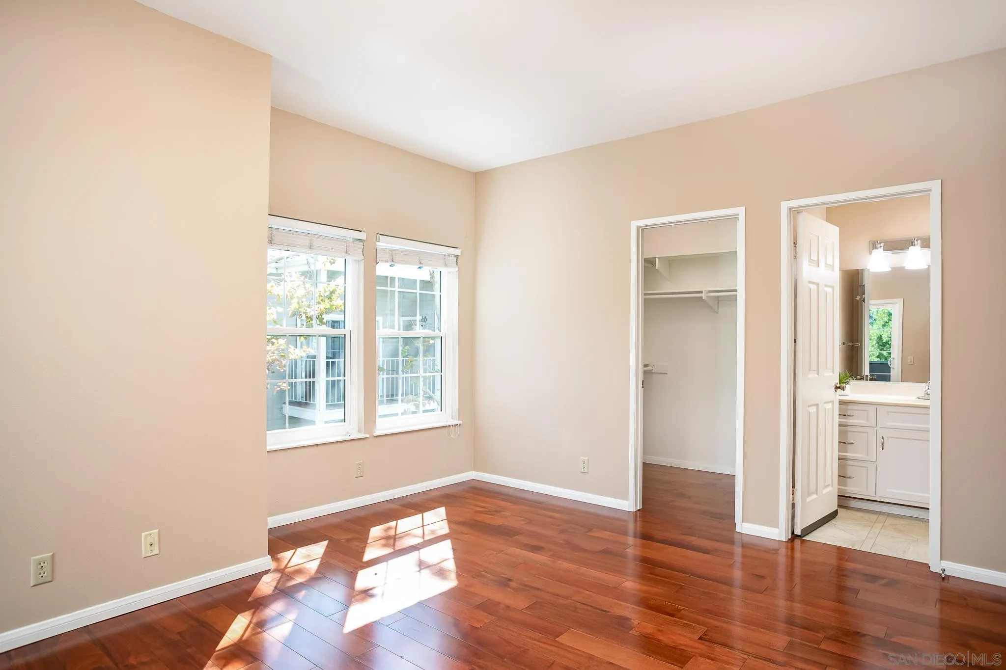 13816 Midland Road Poway, CA 92064 - Photo 12 of 37 an empty room with wooden floor and windows