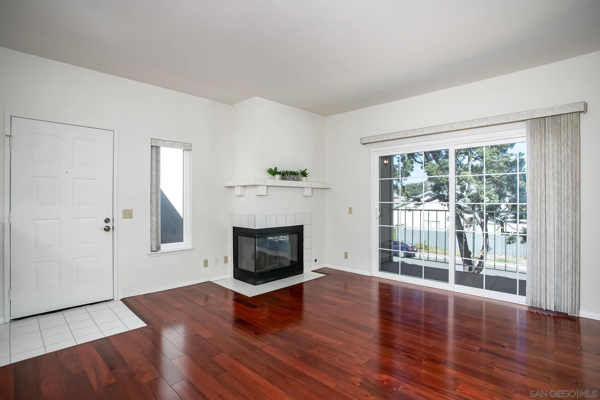 13816 Midland Road Poway, CA 92064 - Photo 3 of 37 a view of empty room with wooden floor and fireplace
