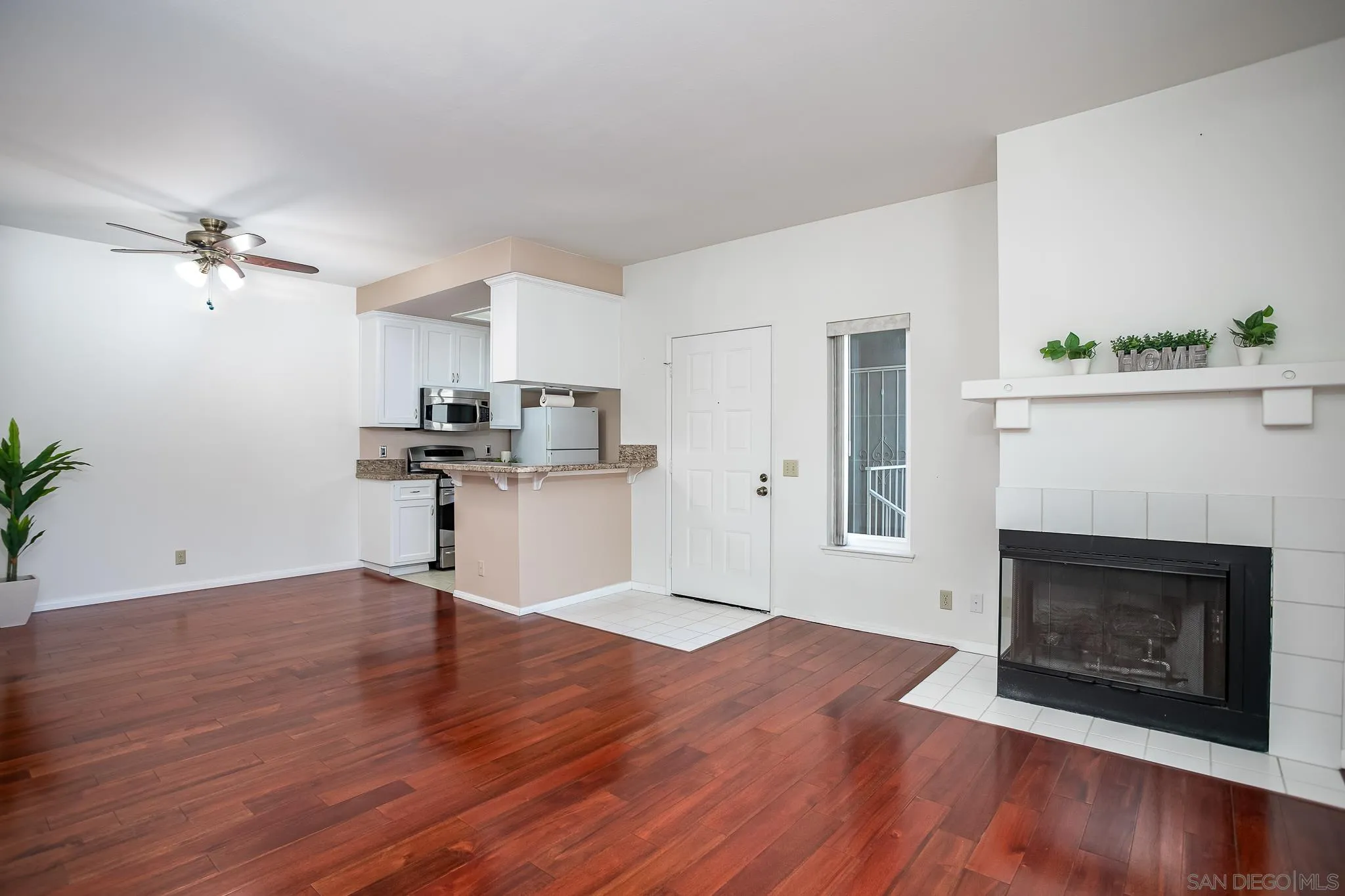 13816 Midland Road Poway, CA 92064 - Photo 4 of 37 a view of empty room with wooden floor and fireplace