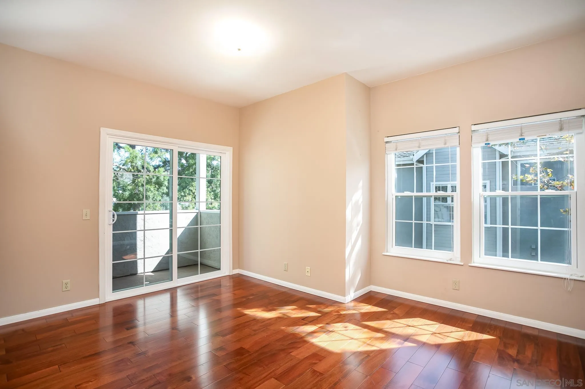 13816 Midland Road Poway, CA 92064 - Photo 10 of 37 a view of an empty room with wooden floor and a window