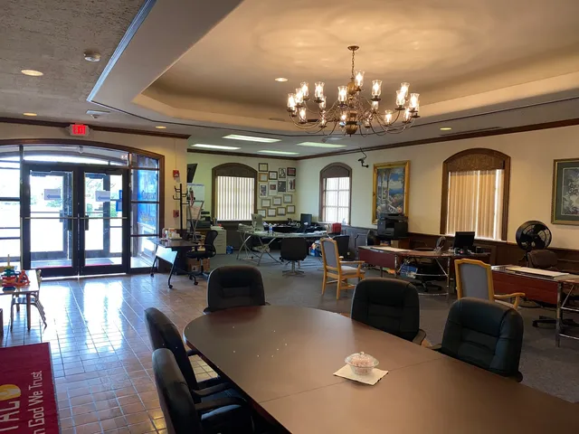 a reading room with furniture and wooden floor