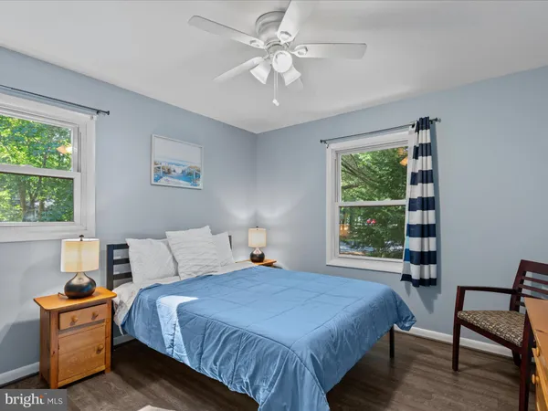 a bedroom with a bed and flat screen tv