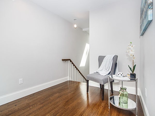 24-26 Beaconsfield Road, Unit 26 Brookline, MA 02445 - Photo 17 of 25 a view of a room with wooden floor table and chairs