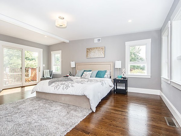 24-26 Beaconsfield Road, Unit 26 Brookline, MA 02445 - Photo 21 of 25 a view of a bedroom with wooden floor and window