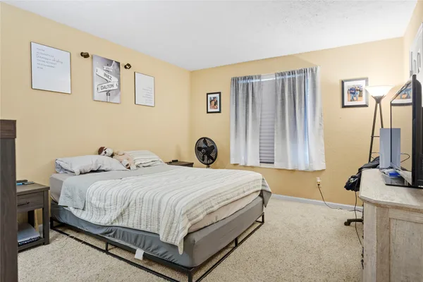 a bedroom with a bed and walk in closet