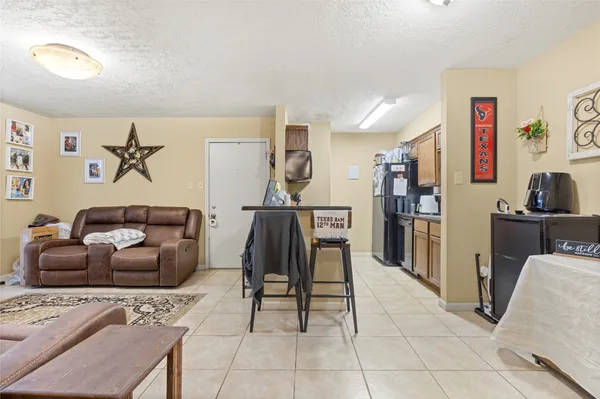 a living room with furniture and a table