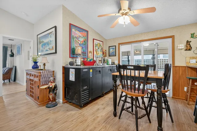 a kitchen with stainless steel appliances granite countertop a sink dishwasher and cabinets with wooden floor