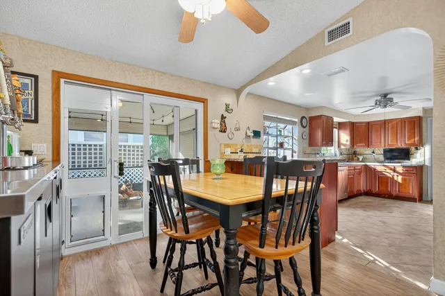 a kitchen with lots of counter top space and dining table
