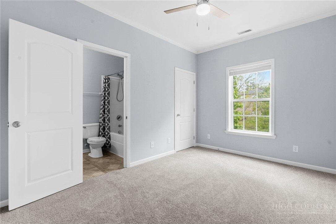 211 Cecil Miller Road, Unit 9 Boone, NC 28607 - Photo 13 of 32 a view of an empty room with a window
