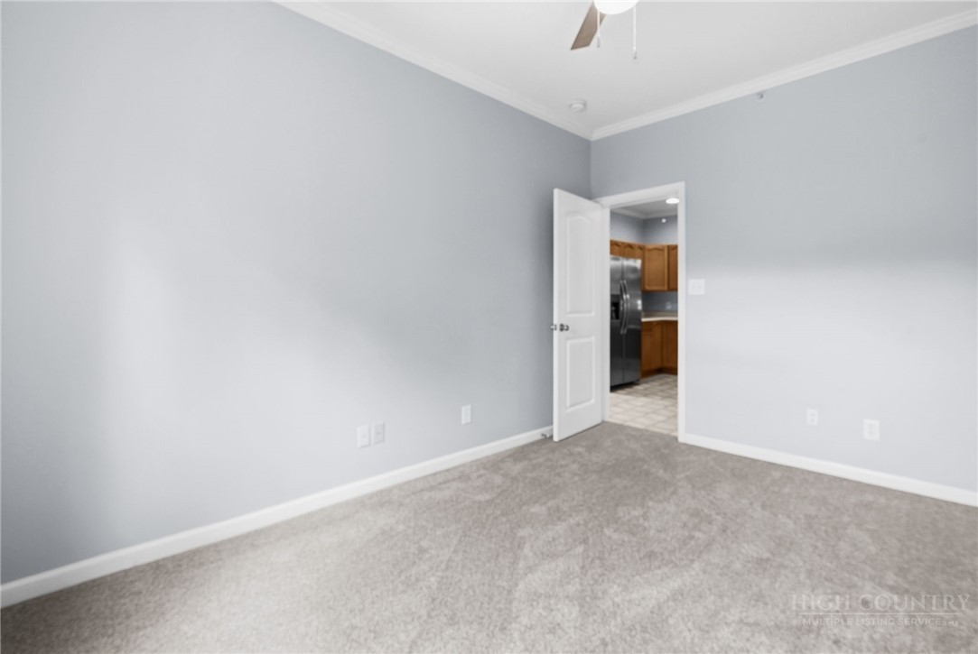 211 Cecil Miller Road, Unit 9 Boone, NC 28607 - Photo 14 of 32 an empty room with an entryway and an entrance