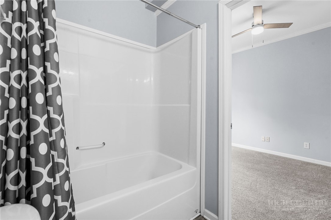 211 Cecil Miller Road, Unit 9 Boone, NC 28607 - Photo 16 of 32 a bathroom with a bathtub and a shower