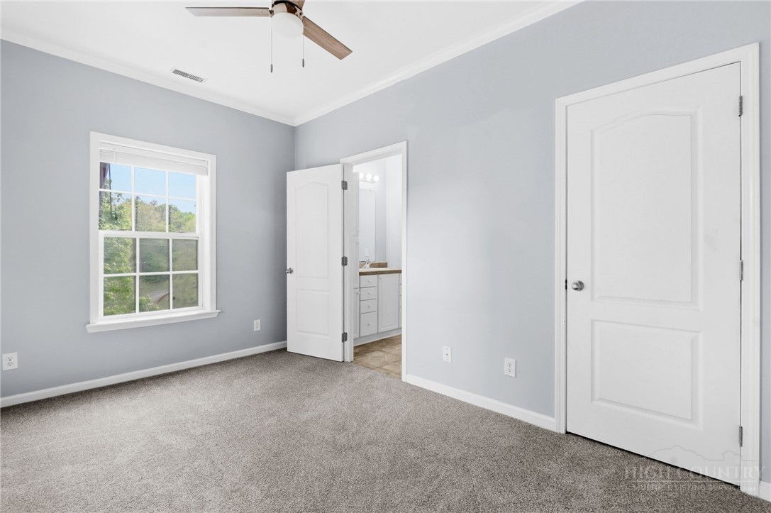 211 Cecil Miller Road, Unit 9 Boone, NC 28607 - Photo 17 of 32 an empty room with windows and closet