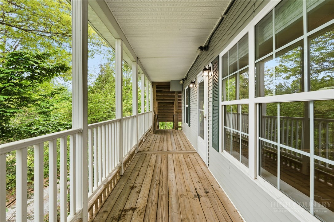 211 Cecil Miller Road, Unit 9 Boone, NC 28607 - Photo 24 of 32 a view of balcony with wooden floor and fence