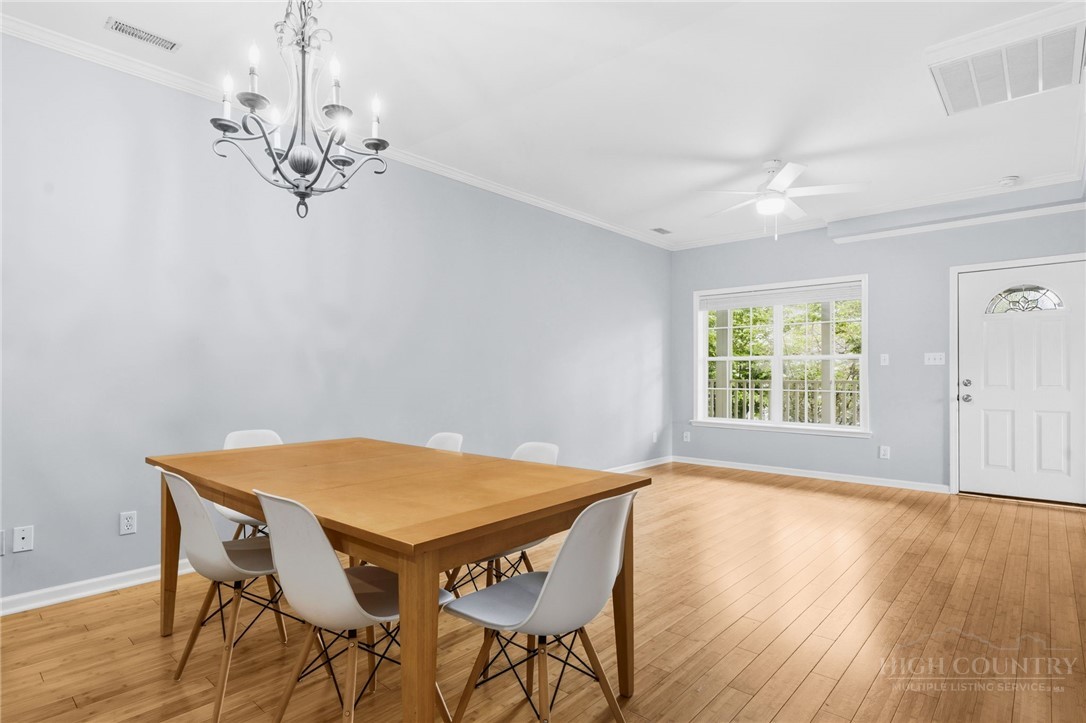 211 Cecil Miller Road, Unit 9 Boone, NC 28607 - Photo 4 of 32 a view of a dining room with furniture and chandelier