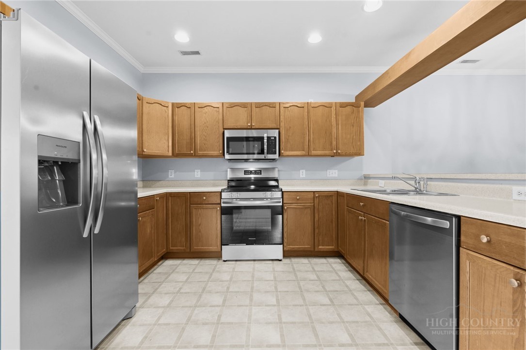 211 Cecil Miller Road, Unit 9 Boone, NC 28607 - Photo 6 of 32 a kitchen with stainless steel appliances granite countertop a refrigerator sink and stove