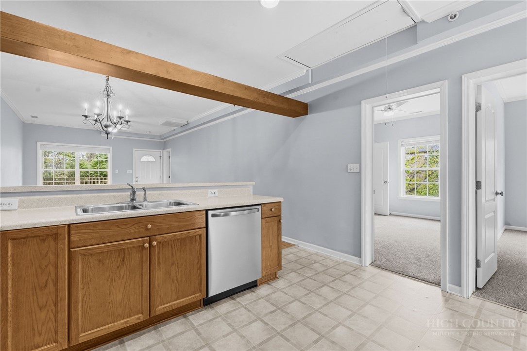 211 Cecil Miller Road, Unit 9 Boone, NC 28607 - Photo 8 of 32 a view of a kitchen with a sink and chandelier
