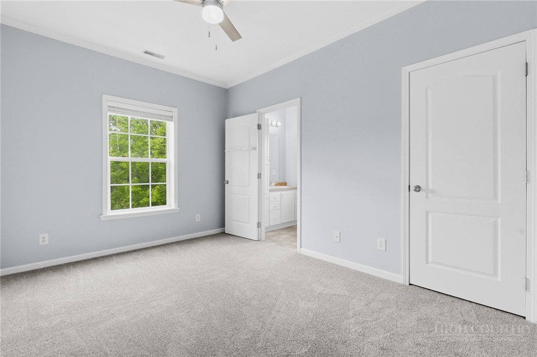 211 Cecil Miller Road, Unit 9 Boone, NC 28607 - Photo 9 of 32 a view of an empty room with a window