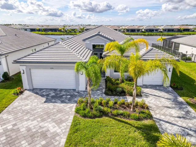 an aerial view of a house with a lake view
