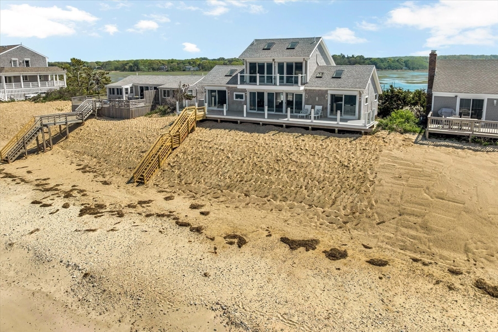 90 Salt Marsh Road East Sandwich, MA 02537 - Photo 39 of 40 a view of a house with a swimming pool