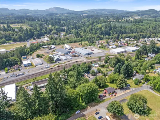 an aerial view of a city with mountains