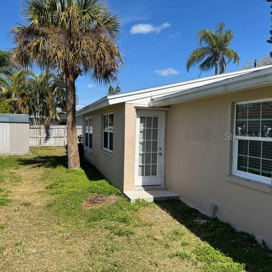 2154 Cedar Drive Dunedin, FL 34698 - Photo 18 of 19 a view of a house with a yard