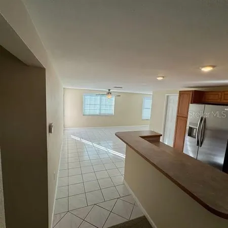 a kitchen with stainless steel appliances granite countertop a sink and a stove
