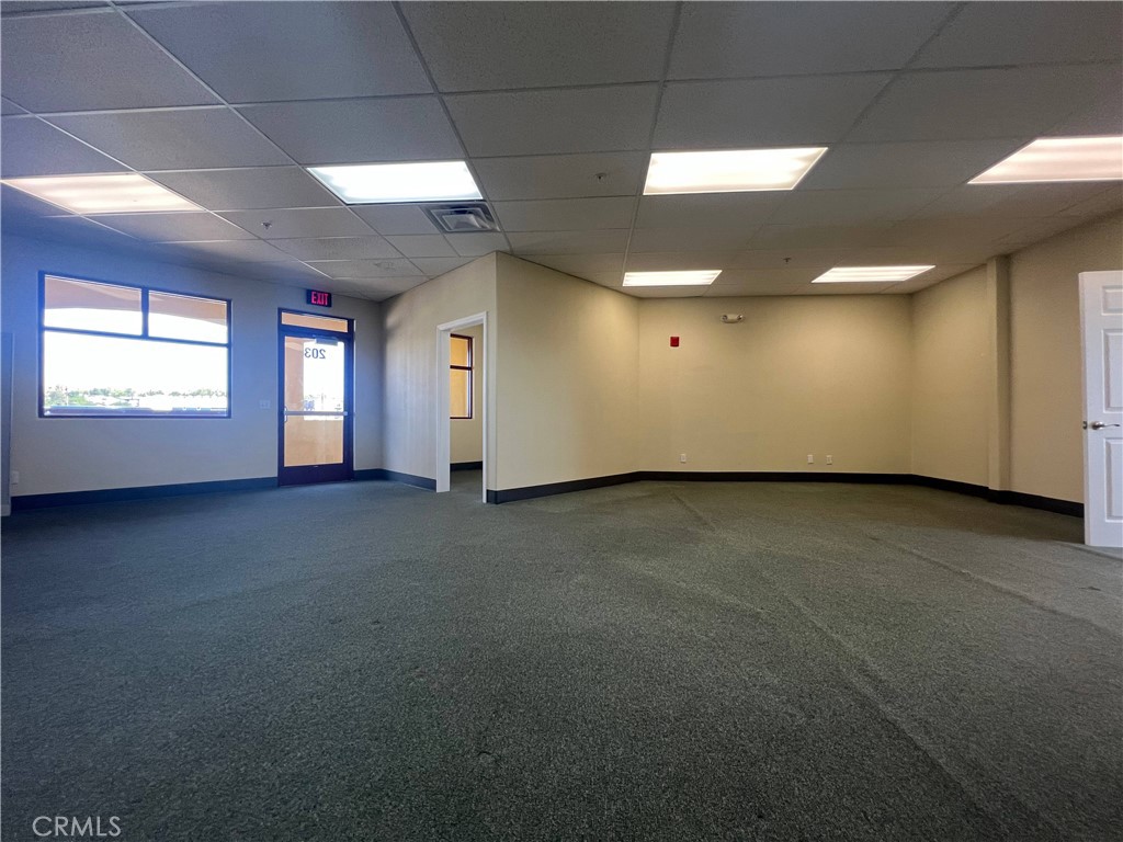 16070 Tuscola Road, Unit 203 Apple Valley, CA 92307 - Photo 6 of 14 a view of an empty room with a window